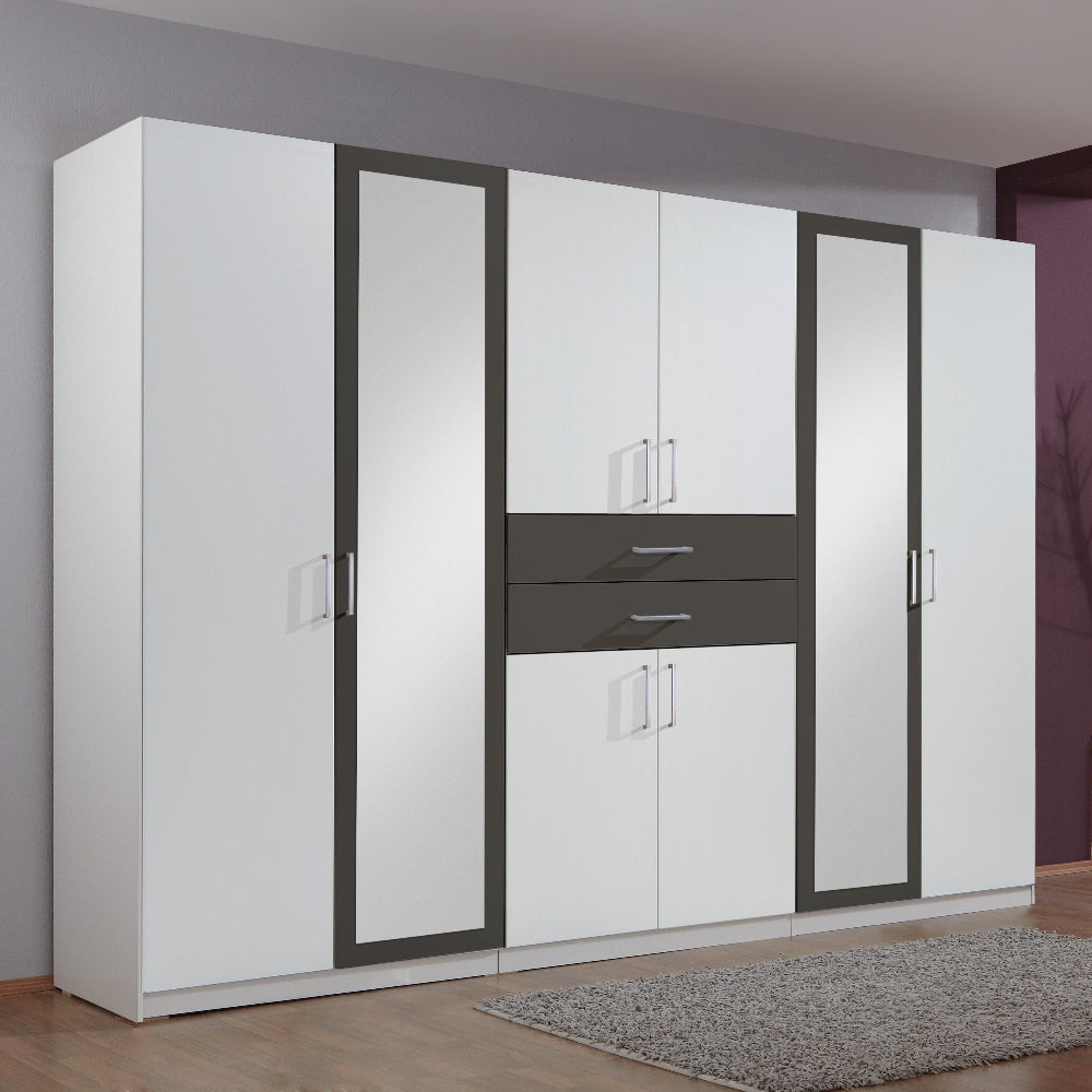 White wardrobe with black accents in a room with a window and chair.